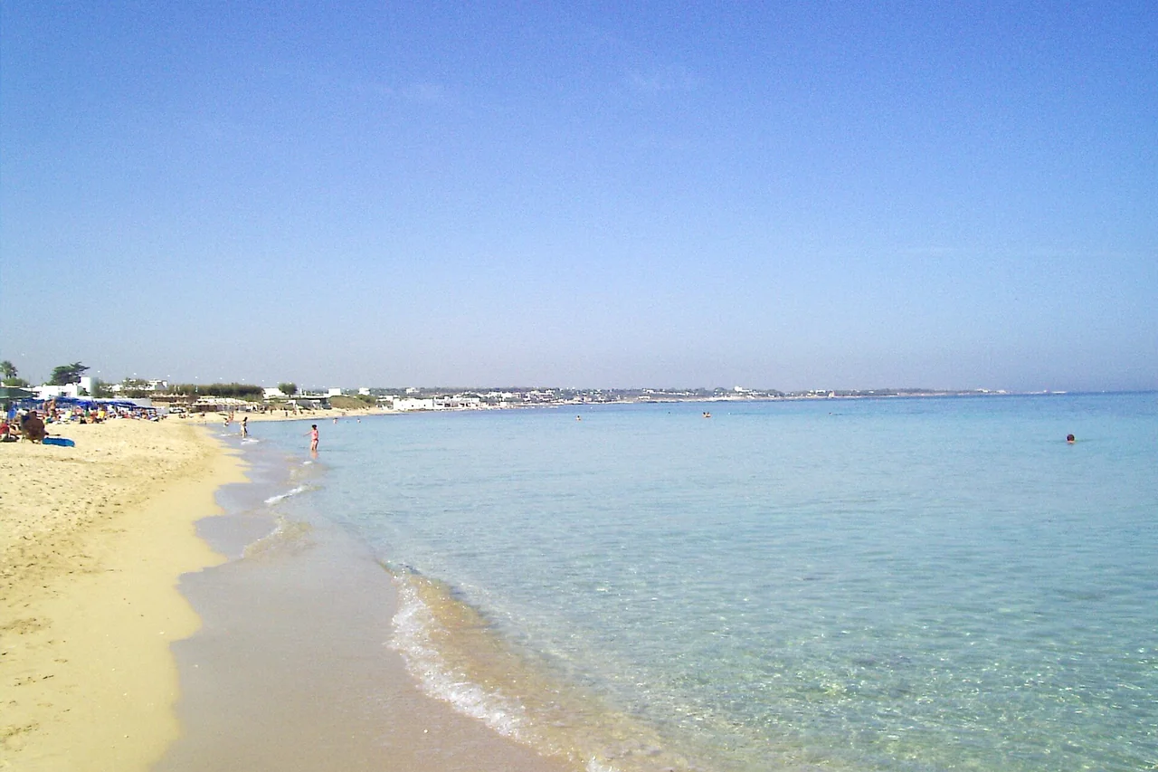 Sandy shoreline and clear Adriatic water at Capitolo south of Monopoli